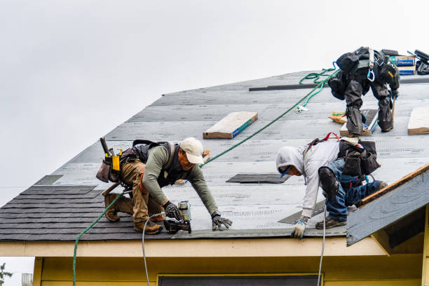 Professional Gutter Installation technician working in Tehama, CA